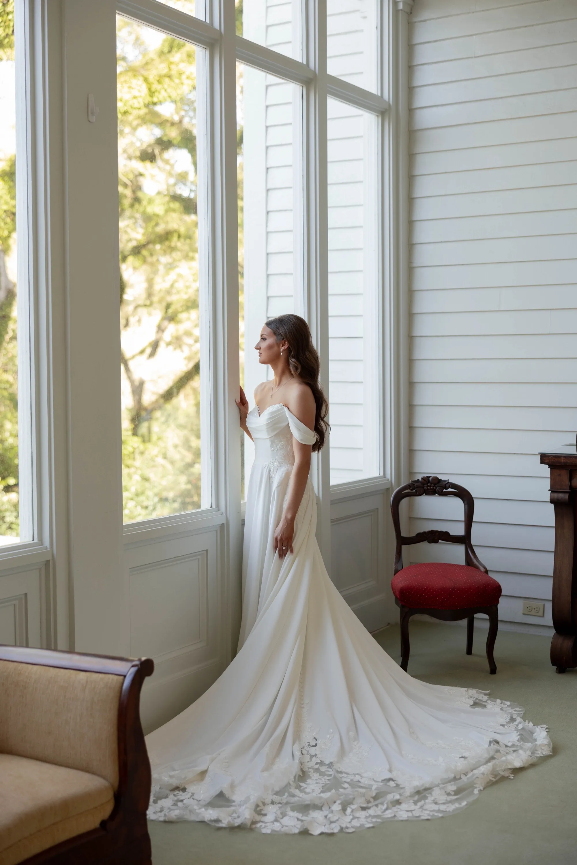 Watching the garden from the tall windows before the ceremony