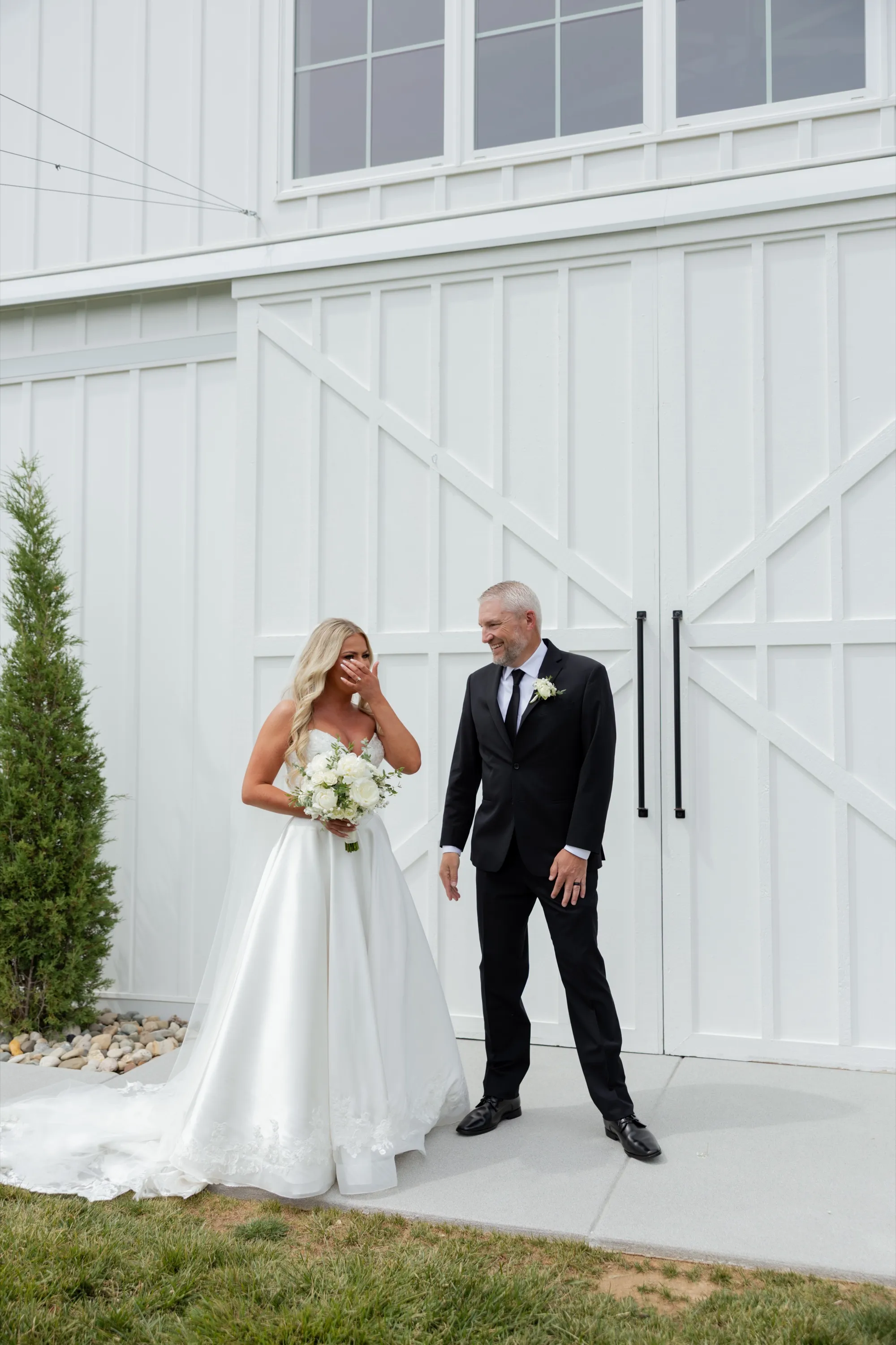 Taylor wipes away a tear as her dad sees her in her gown for the first time