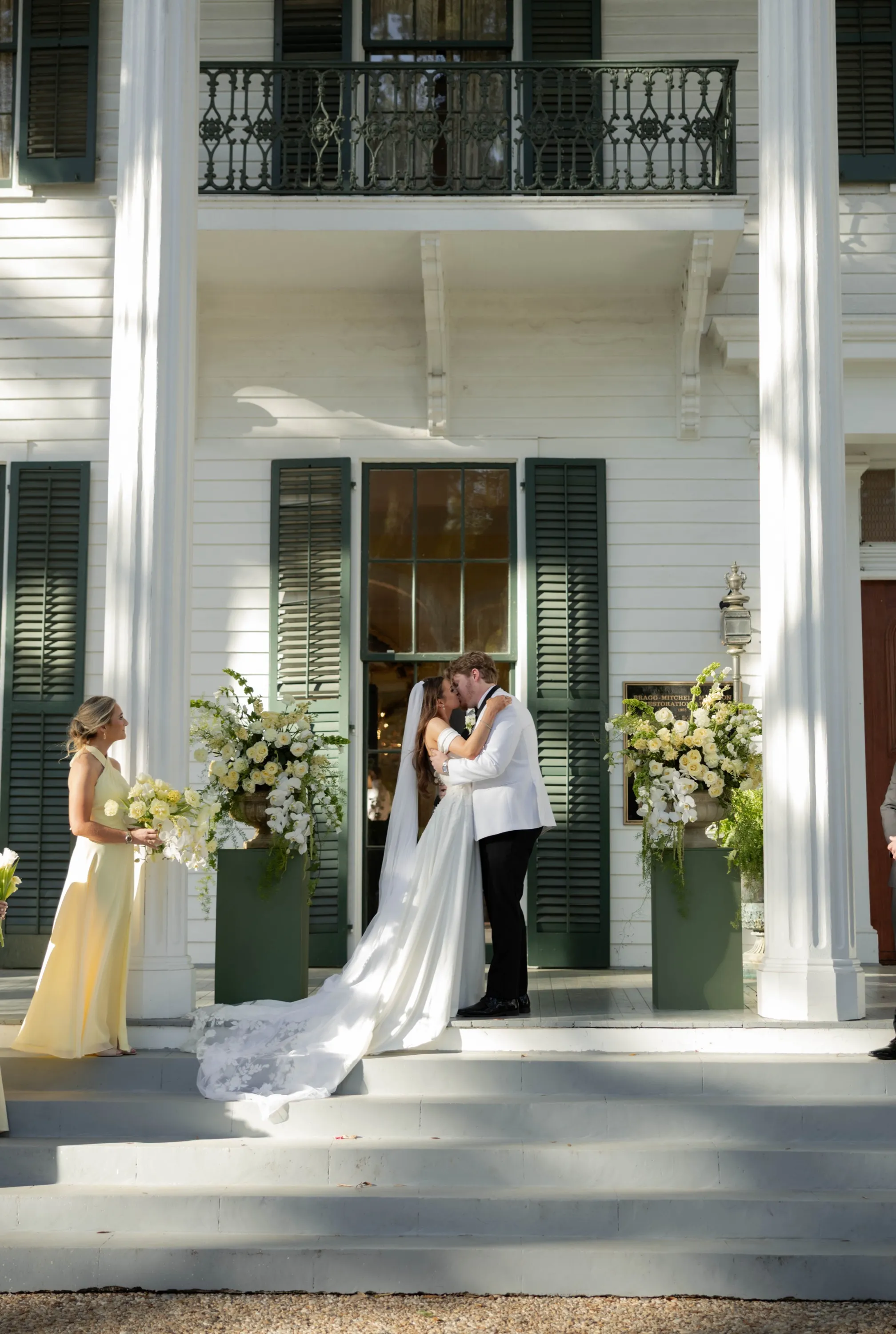 The first kiss on the steps, flowers on either side