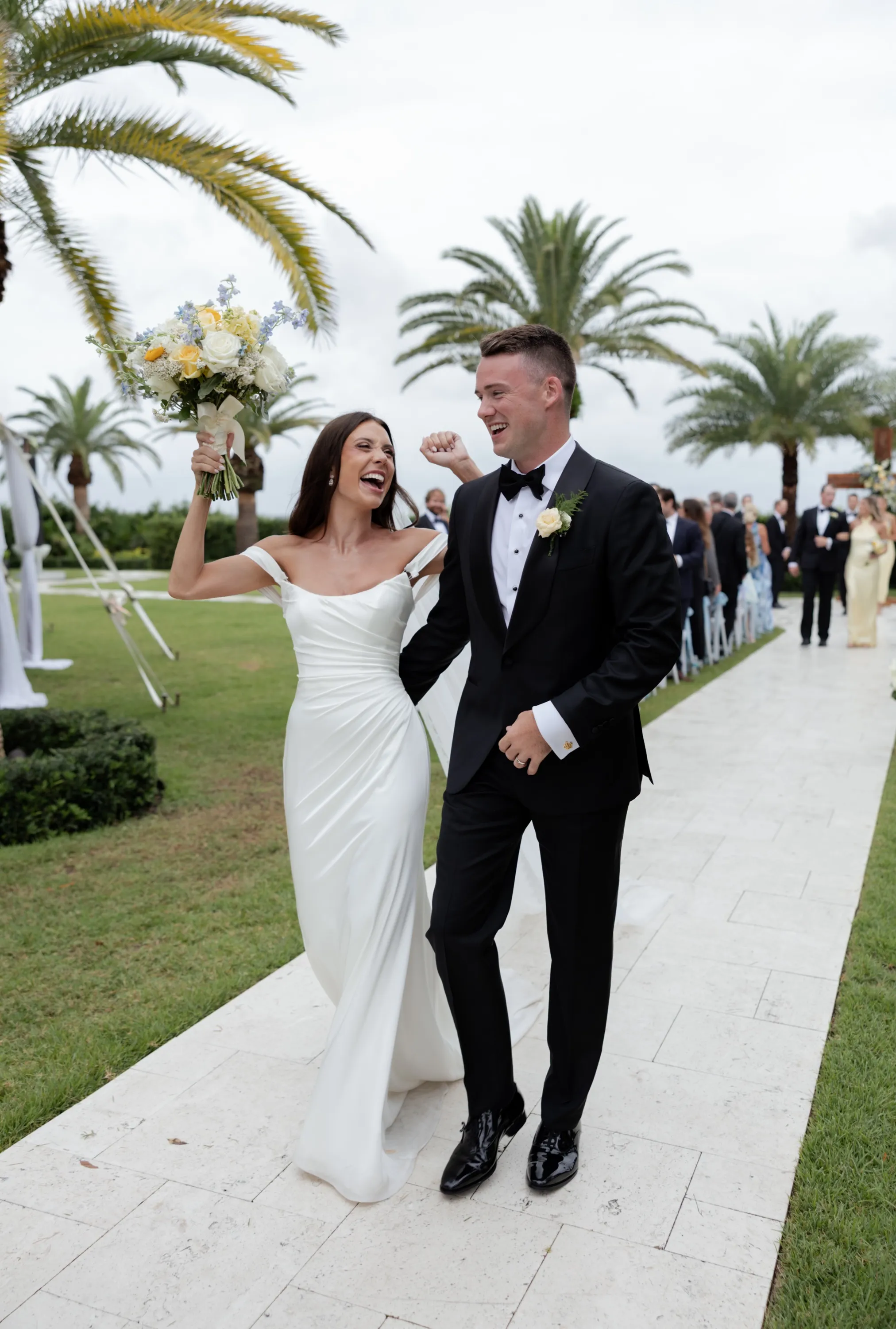 Back up the aisle, Savannah's bouquet in the air