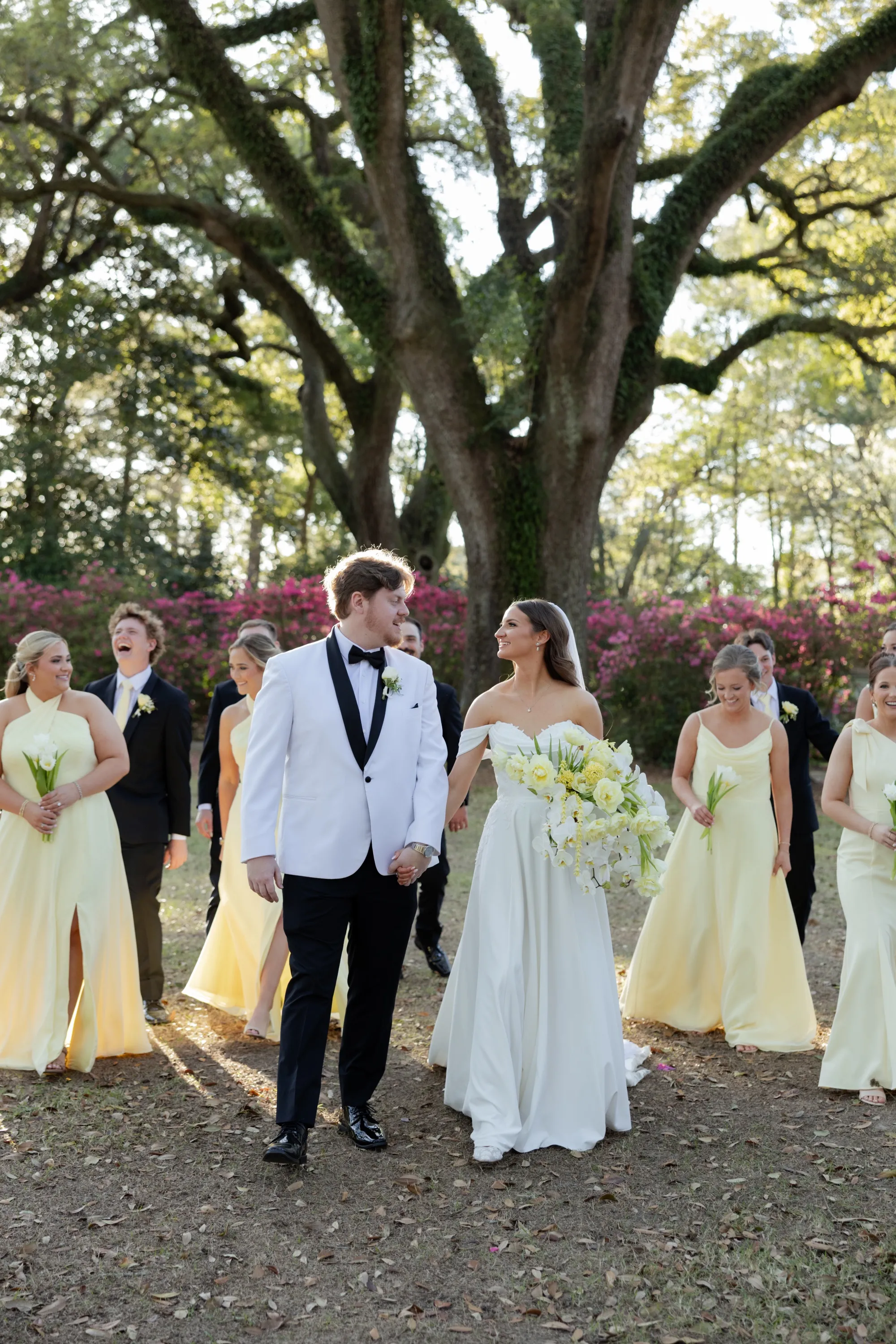 A glance between them on the walk, the wedding party following