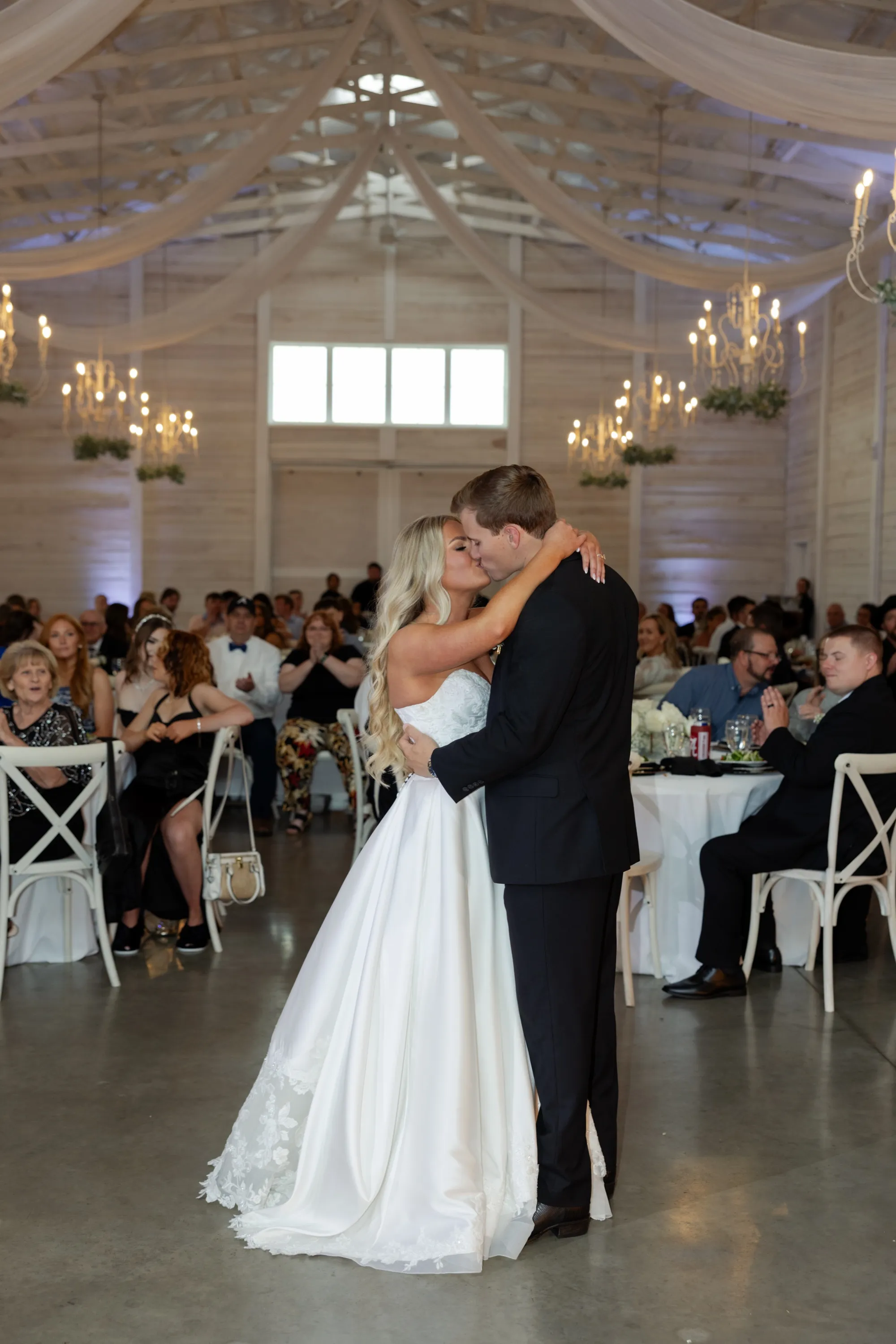Taylor and Andru's first dance under the chandeliers