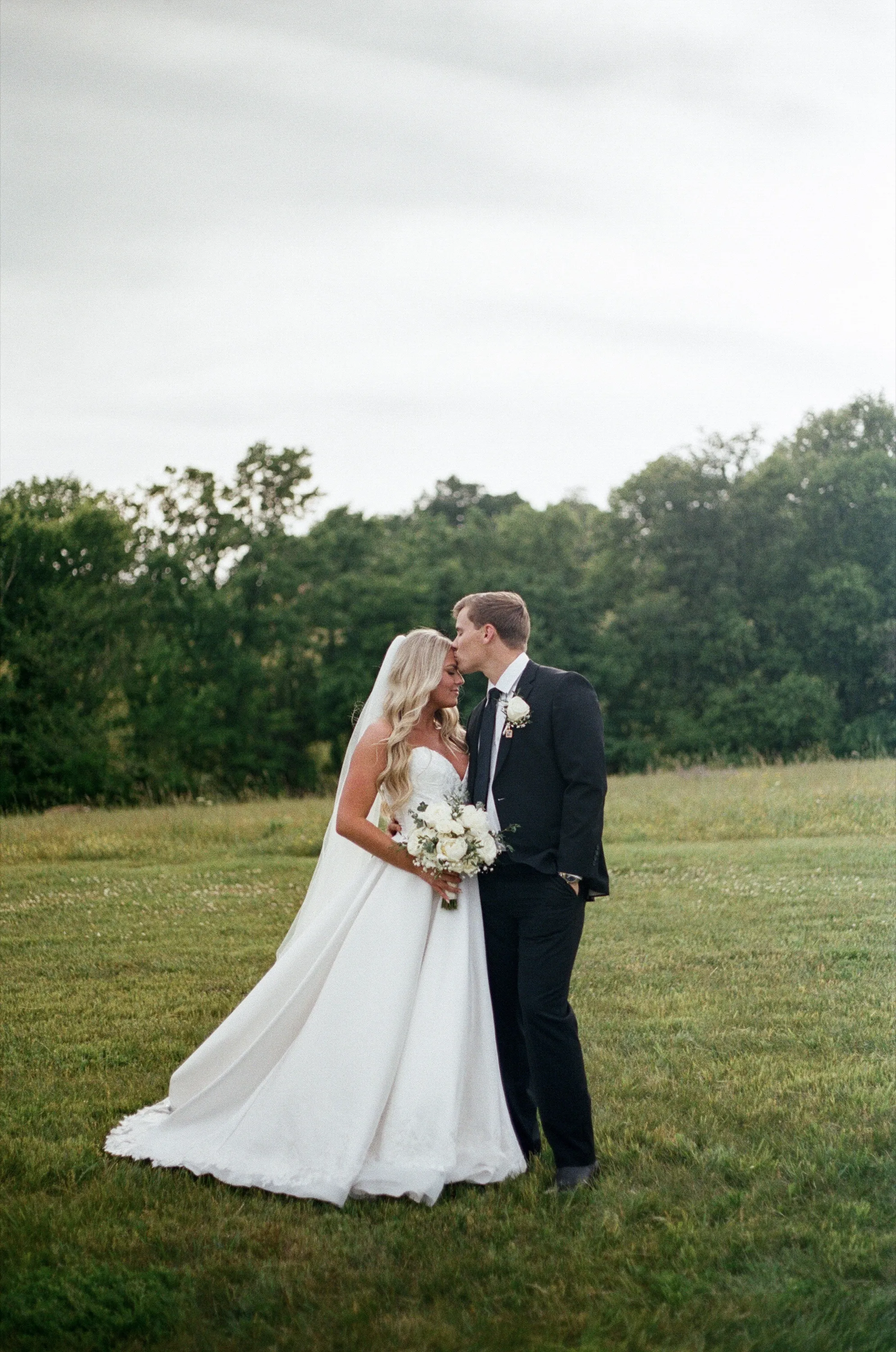 A 35mm photograph of a bride and groom in the Nashville, TN countryside