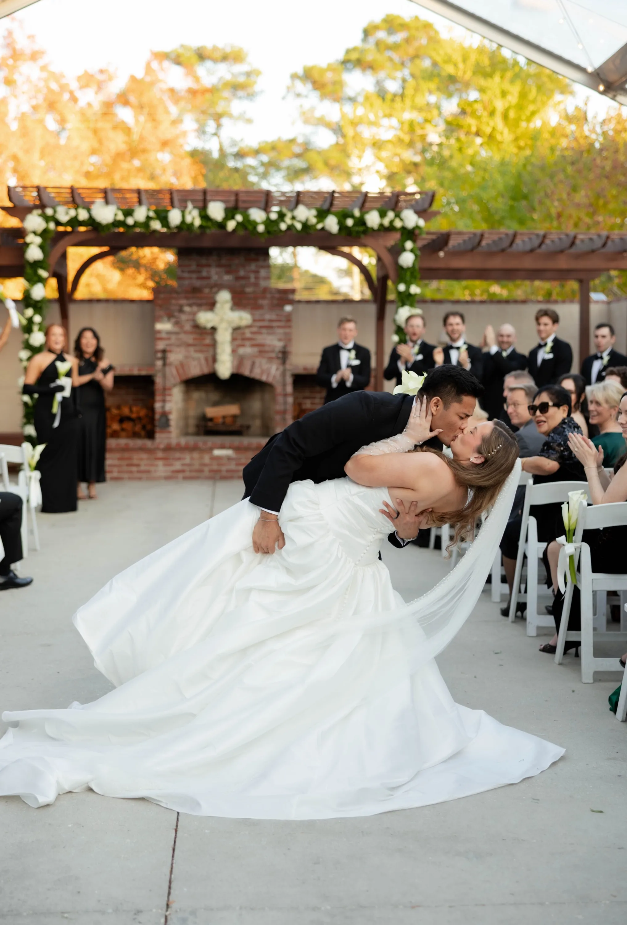 A dip kiss back up the aisle as guests applaud