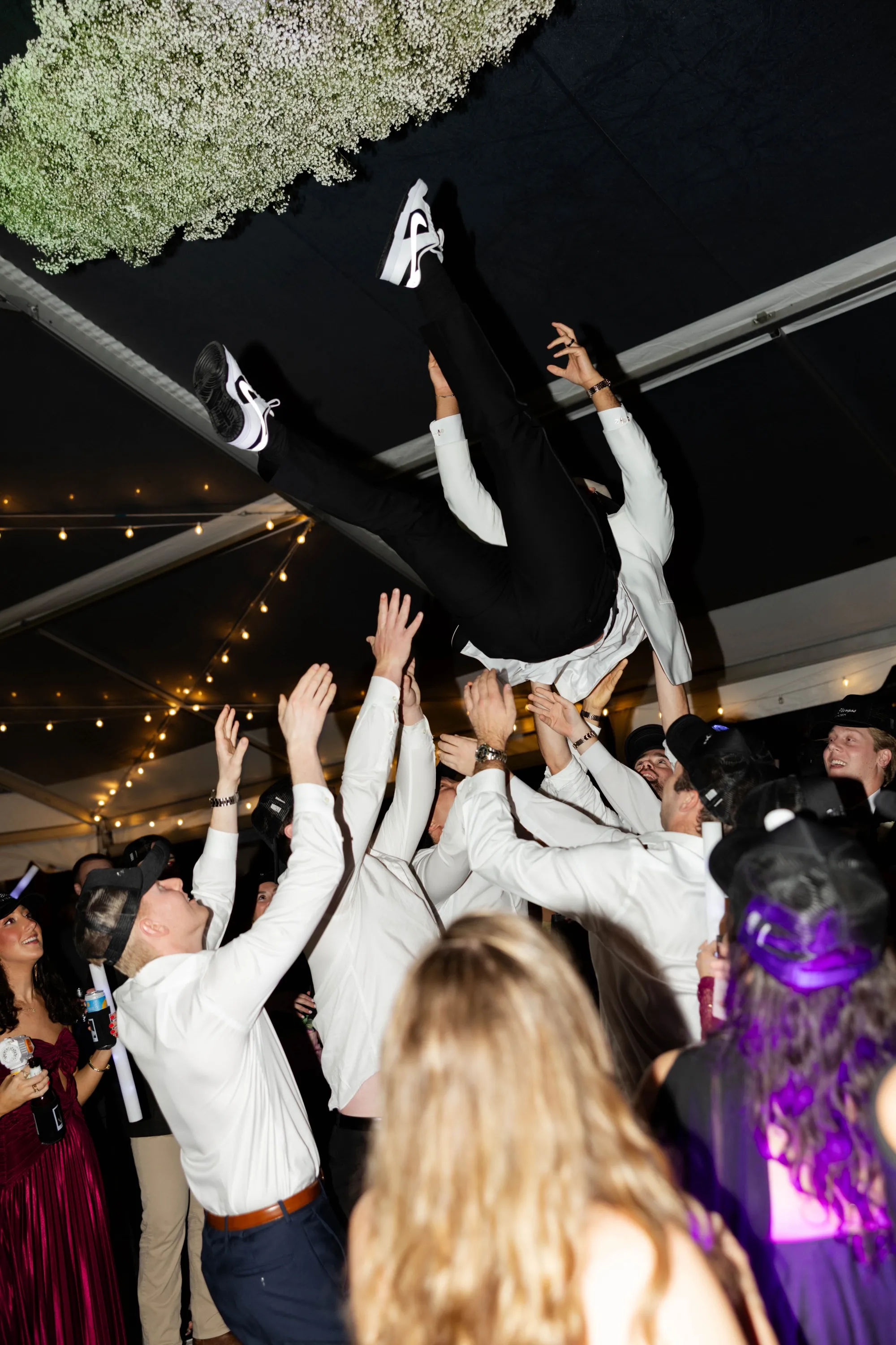 Edgar in the air above the dance floor, baby's breath overhead