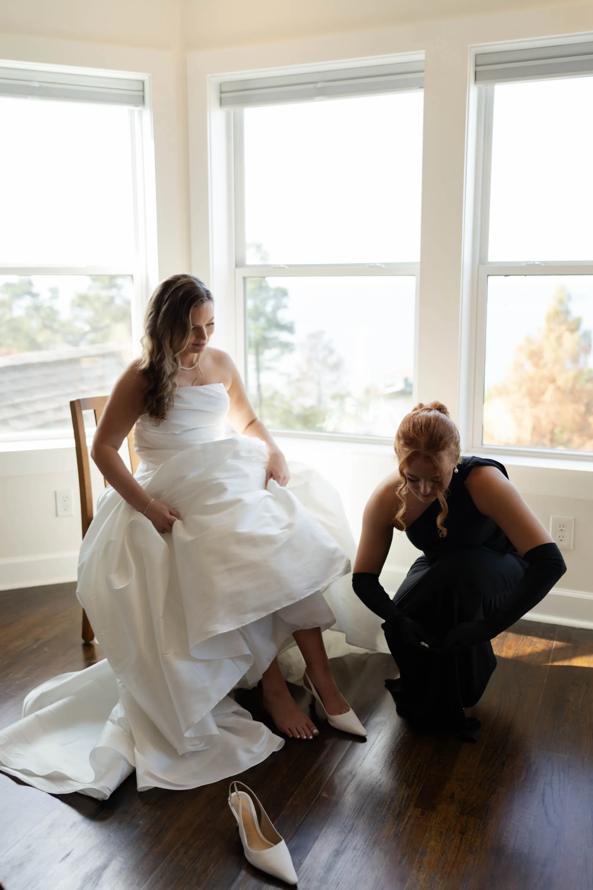 A final touch — Lily's shoe fastened before the first look