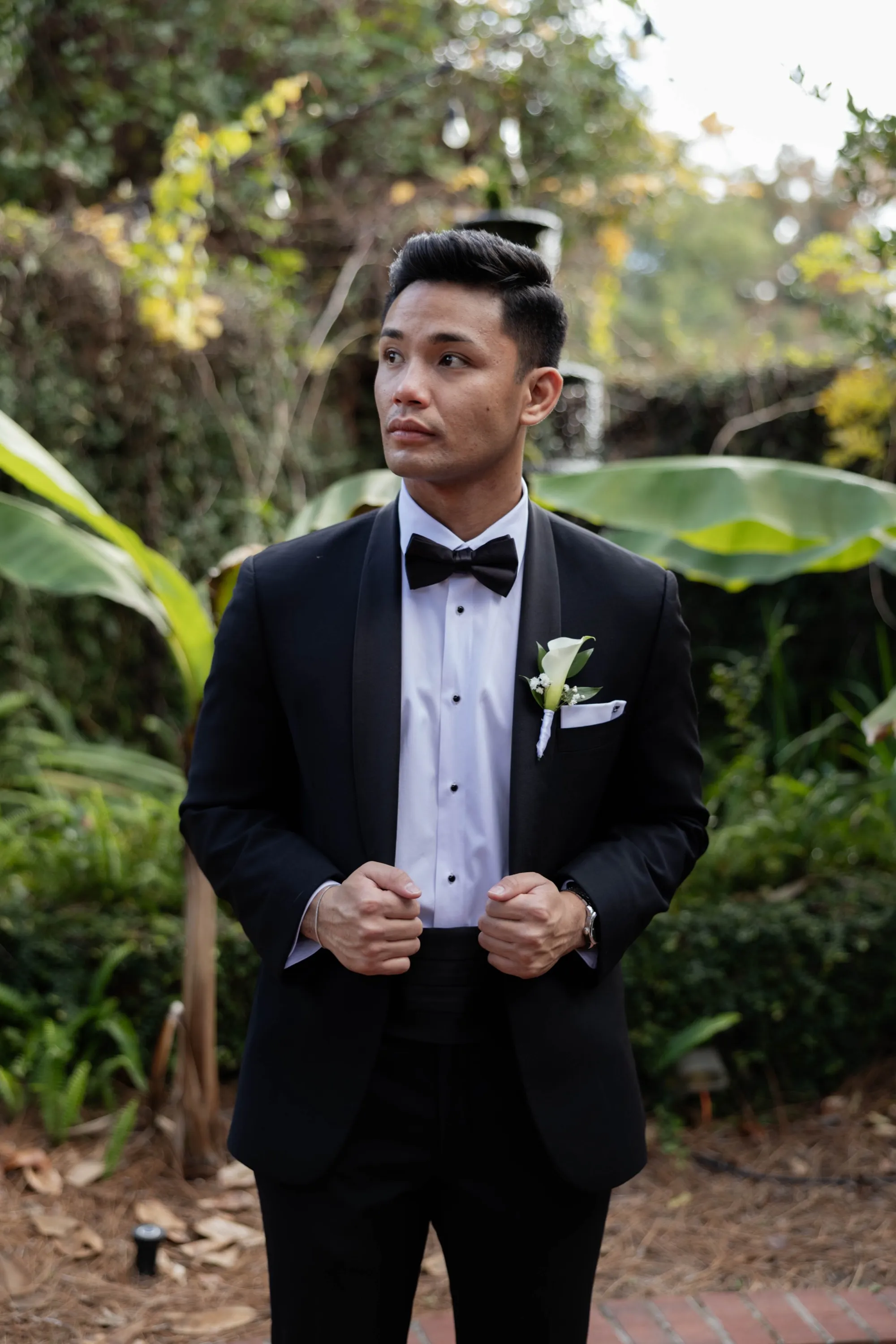 Edgar in his tuxedo, calla lily boutonniere in place