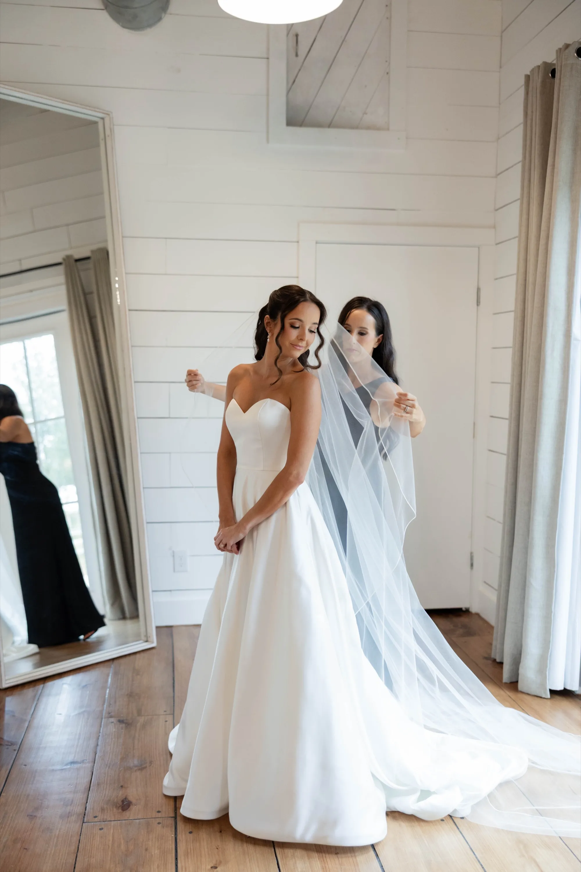 The veil placed in the shiplap dressing room at The Oaks